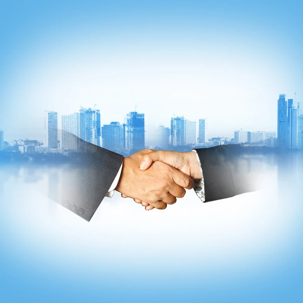 business handshake with urban city background